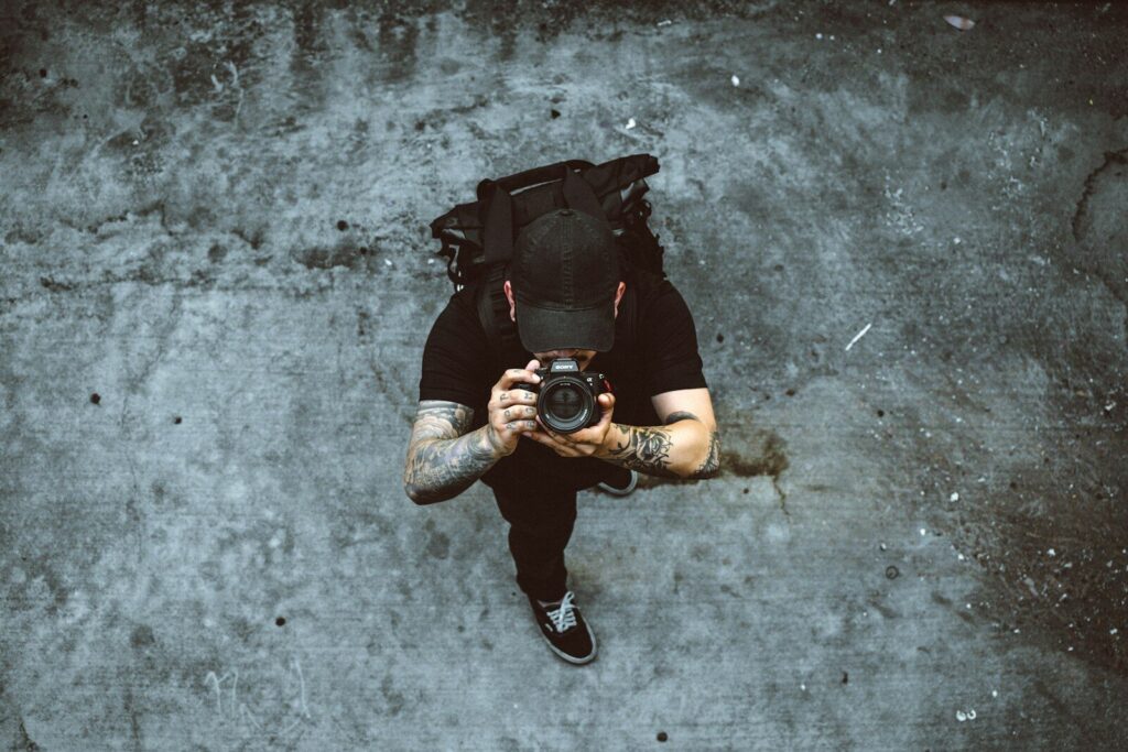 Professional photographer at work outdoors.
